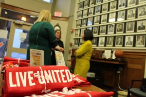 Live United t-shirt with people talking in the background