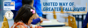 Child working at desk with United Way logos