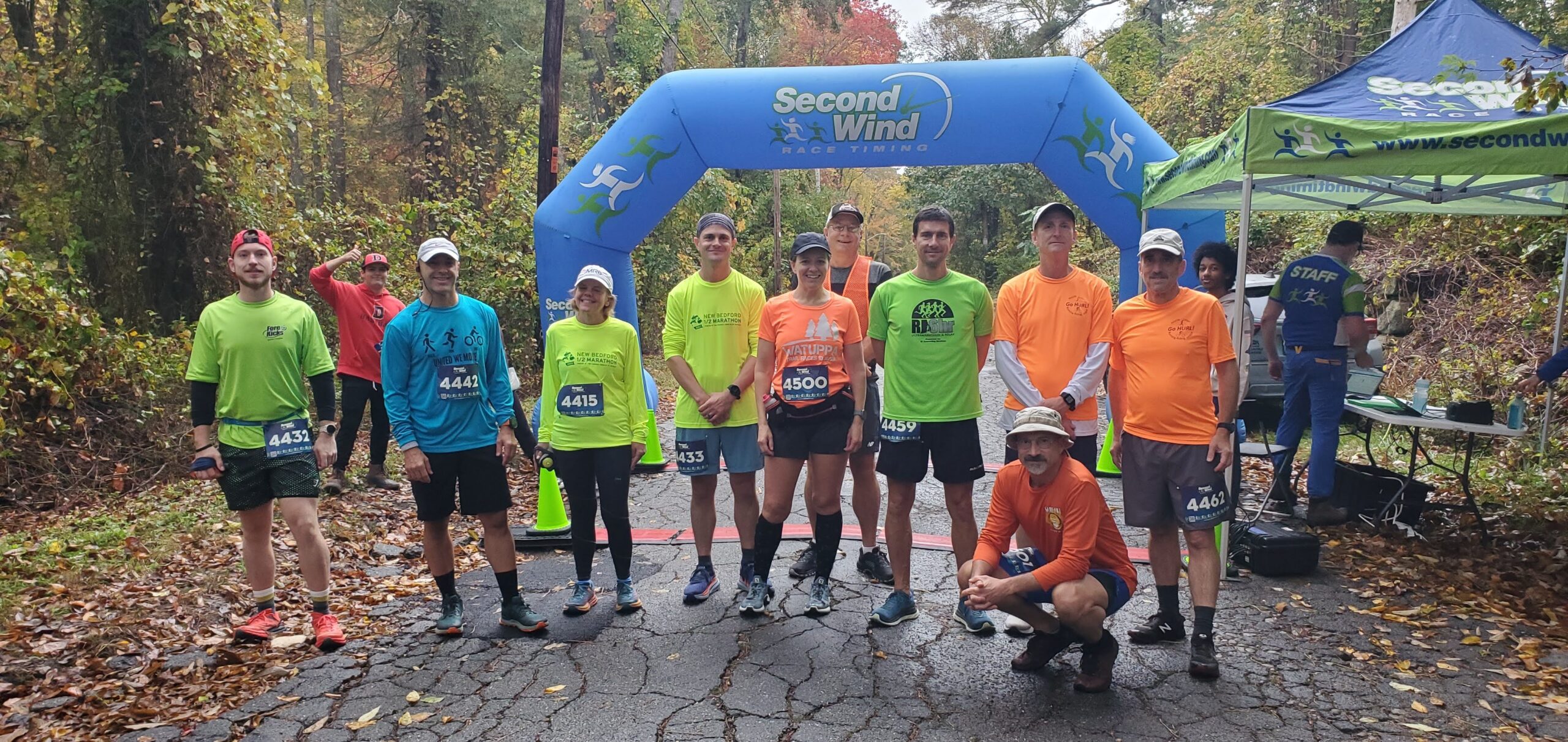 United We Move Trailfest Run. participants pose at race entrance